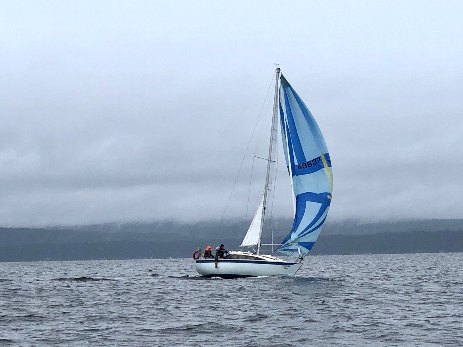 Una flying her spinnaker downwind to the Mill